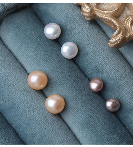 Macro shot of high luster natural freshwater pearls in white, pink, and purple colors