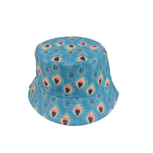 Detailed close-up of teal bucket hat with vibrant yellow and purple peacock feather print