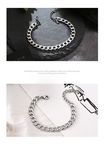 Detailed close-up of polished silver Cuban link bracelet with adjustable lobster clasp