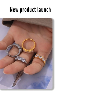 Detail of four-piece minimalist solitaire rings in gold and silver plating