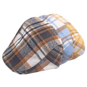 Flat lay of three plaid ivy caps in brown, blue, and yellow with warm wool-like texture