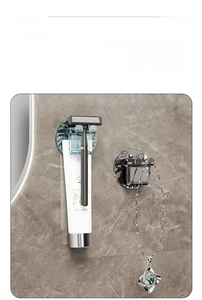 Close-up of wall-mounted organizer rack holding a razor and skin care products on marble wall