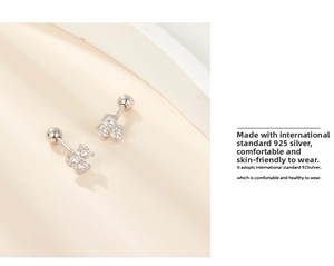 Detail view of S925 sterling silver clover stud earrings with sparkling cubic zirconia
