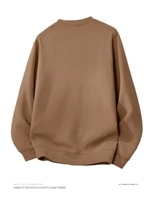 Rear view of brown loose fit crewneck sweatshirt showing ribbed hem and knit texture