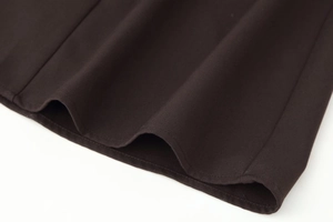 Close-up of espresso brown midi dress featuring fine twill texture and neat hem stitching