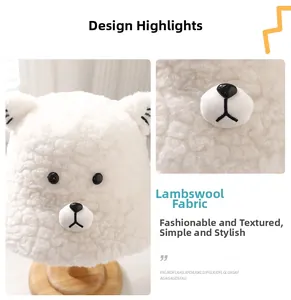 Close-up of white plush lamb wool fabric texture on bear-shaped bucket hat