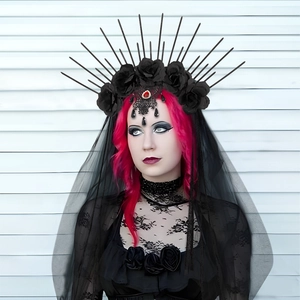 Detail of gothic crown headband with black roses, spiked frame and mesh lace veil