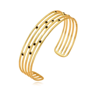 Bracelet manchette ajustable en acier inoxydable doré avec points d'émail noir