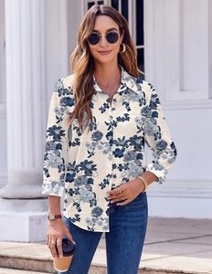 Detail of floral long sleeve shirt featuring navy flower patterns on off-white fabric
