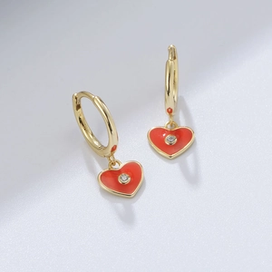 Close-up of S925 silver heart earrings with red enamel finish and sparkling zircon stones