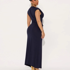Close-up of navy blue sleeveless maxi dress with pleated waist and bodycon fit
