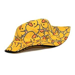Detailed view of yellow duck print fabric and neat stitching on a summer bucket hat