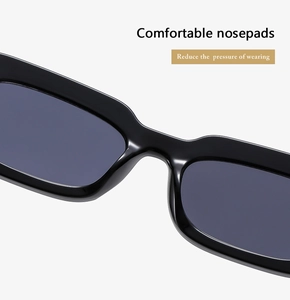 Detail of ergonomic comfortable nose pads on black rectangular sunglasses frame