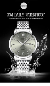 Detail of silver men's watch showing 30m waterproof splash and dual calendar dial
