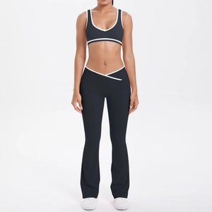 Two-piece yoga set with contrast piping and cross V-waist flared pants in dark grey