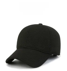 Detail of black winter baseball cap showing textured fabric and M SPORT metal logo