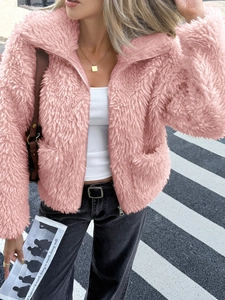 Chic pink faux fur jacket with zipper closure shown in a trendy urban street style setting