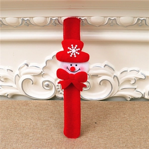 Close-up of red felt Christmas slap bracelet with snowman and snowflake details