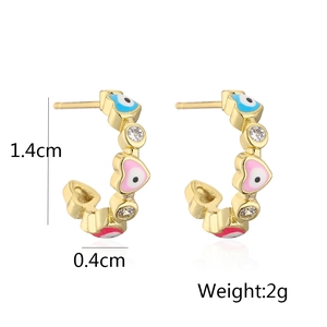 Detail view showing 18K gold plated heart eye C-shaped earrings with colorful zircons