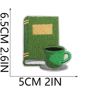 Green coffee cup and book embroidery patch with dimensions 6.5cm by 5cm in high density fabric