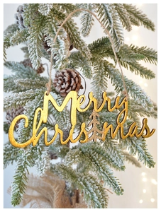 Golden Merry Christmas wooden sign with glitter tree hanging on a snowy branch