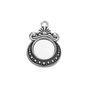 Macro shot of 12mm antique silver pendant with beaded edge and shell pattern detail