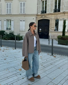 Detailed street style outfit featuring a brown lapel jacket and woven handbag