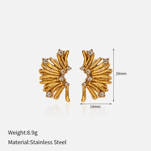 Detail view of gold-plated coral-style earrings with white zircon on stainless steel