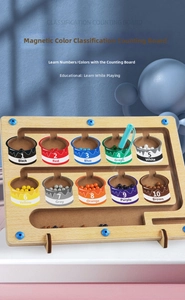 Close-up of magnetic color and number maze puzzle with wooden beads and stylus