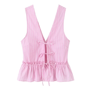 Pink and white striped sleeveless peplum top with front bow ties and a deep V-neckline