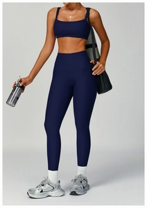 Detail of dark blue ribbed high-waist yoga leggings and square neck sports bra set