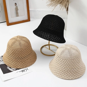 Detailed view of hollow knit sun hats in black, khaki and beige colors for summer
