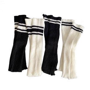 Y2K style knitted leg warmers in black and white with sporty double stripes