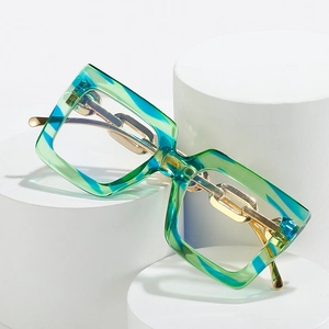 Stylish oversized glasses with turquoise wave frames and golden metal chain temples