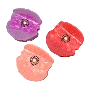 Poppy flower hair claws in purple, red, and pink acetate with marble texture