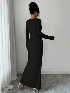 Detail of black knit fishtail maxi dress with elegant long sleeves and slim fit design