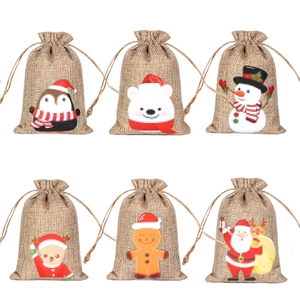 Christmas burlap drawstring bags featuring Santa, penguin, and snowman festive patterns