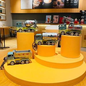 Cartoon dinosaur construction truck keychain set with excavator and crane models