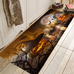 Close-up of Halloween flannel runner with glowing pumpkins, bats and moon on wood floor
