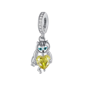 Detailed macro shot of an S925 sterling silver cat charm with a yellow heart crystal