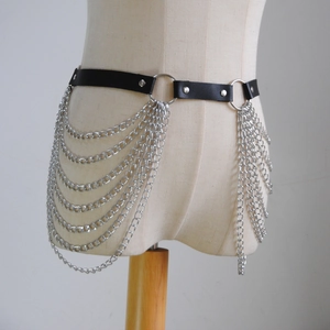 Detail view of punk style black PU leather waist chain with layered silver metal fringes