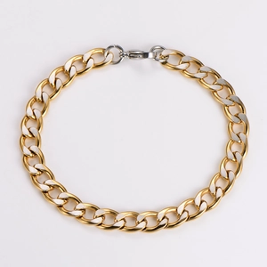 Detailed macro view of 7mm two-tone gold and silver NK curb chain with lobster clasp