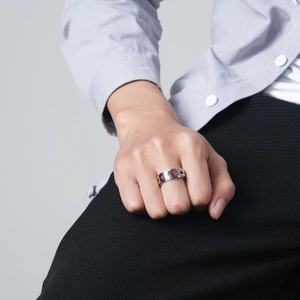 Stainless steel spinner ring with red and black poker suit patterns on a silver band