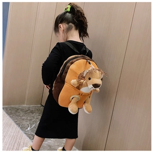 Rear view of a girl wearing an orange plush lion backpack with cute stuffed animal detail