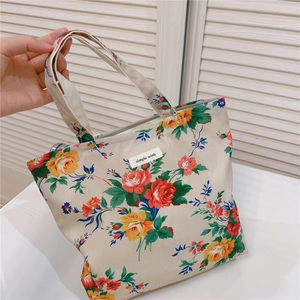 Close-up of floral cotton tote bag featuring Simple Wish label and vintage flower pattern