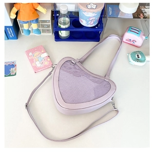 Detail of purple heart-shaped ita bag with transparent window for cute display