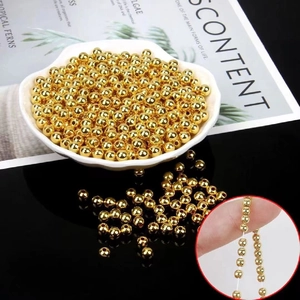 Polished 14k gold-filled solid spacer beads for DIY jewelry making in a shell tray