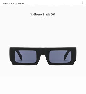 Detail of square vintage punk sunglasses in glossy black frame with metallic rivet accents