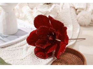 Close-up of a 25cm burgundy velvet Christmas flower with glitter edges for holiday decor