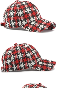 Macro detail of houndstooth knit texture on a winter baseball cap with thick wool fabric